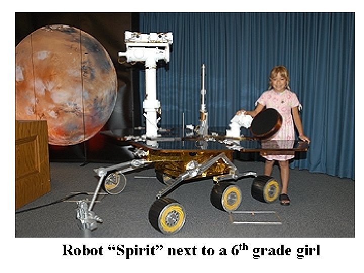 Robot “Spirit” next to a 6 th grade girl 