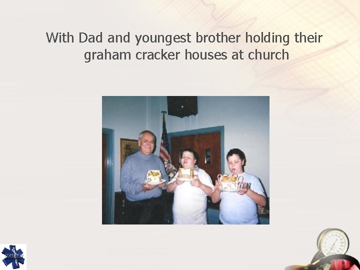 With Dad and youngest brother holding their graham cracker houses at church 