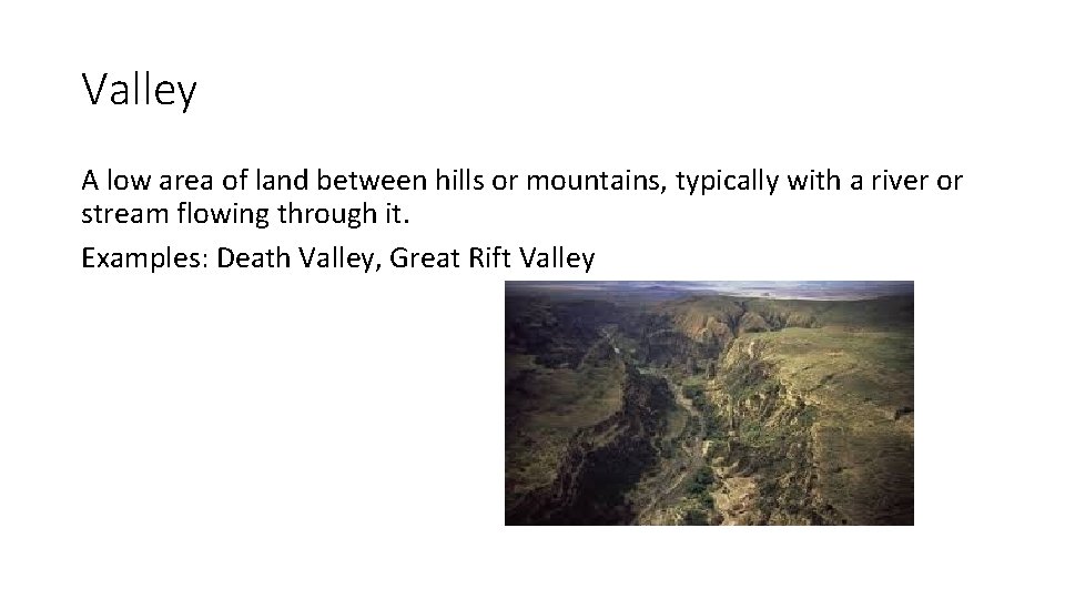 Valley A low area of land between hills or mountains, typically with a river