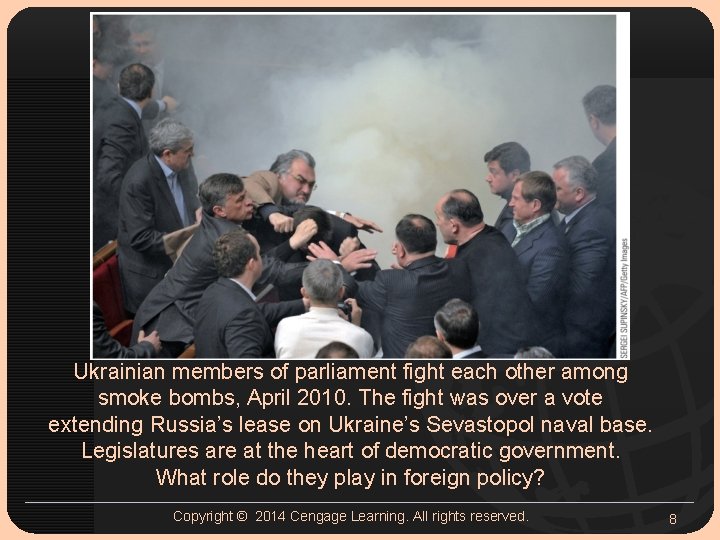 Ukrainian members of parliament fight each other among smoke bombs, April 2010. The fight