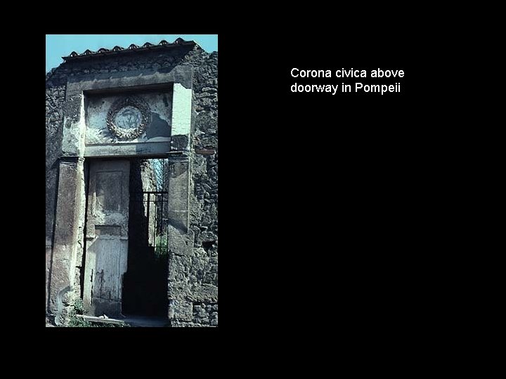 Corona civica above doorway in Pompeii 