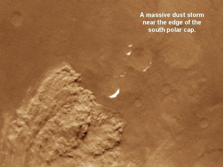A massive dust storm near the edge of the south polar cap. 