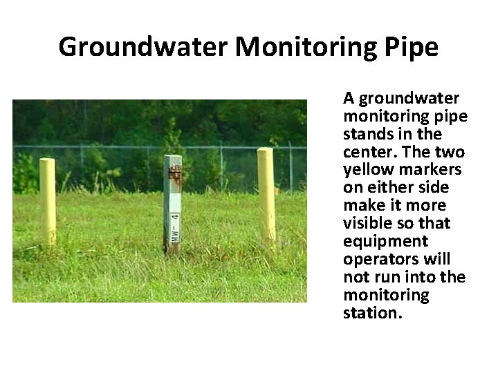 Groundwater Monitoring Pipe A groundwater monitoring pipe stands in the center. The two yellow