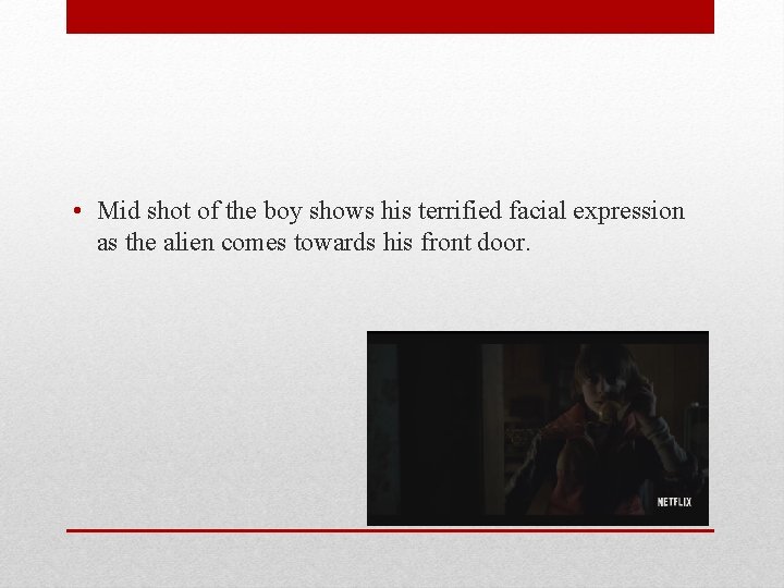  • Mid shot of the boy shows his terrified facial expression as the