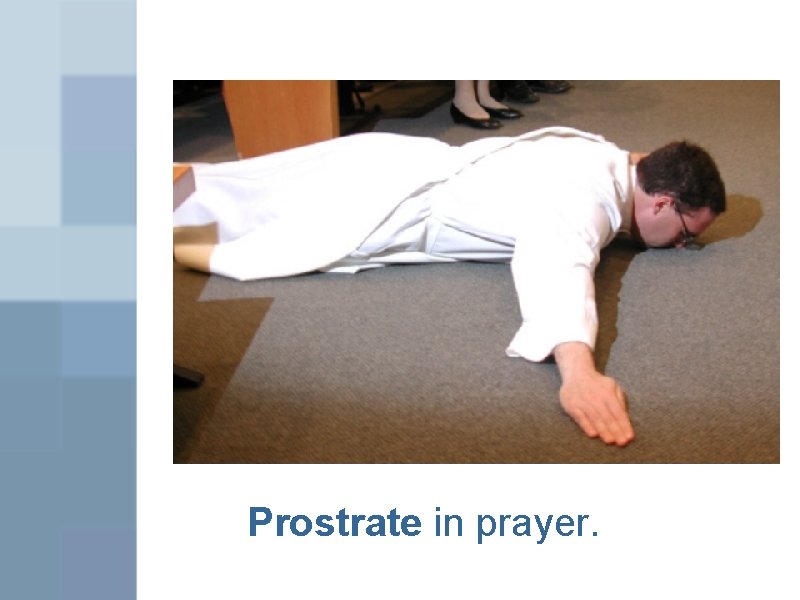 Prostrate in prayer. 