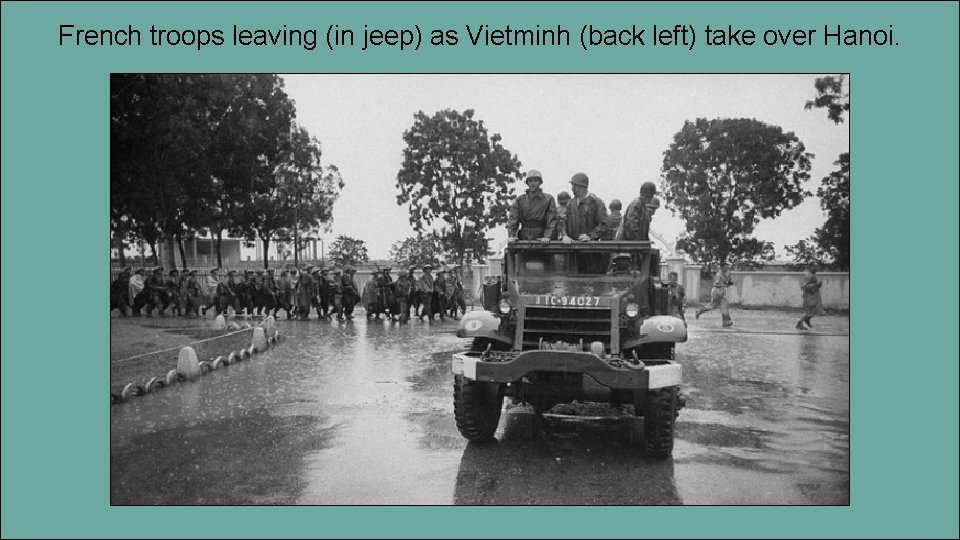 French troops leaving (in jeep) as Vietminh (back left) take over Hanoi. 
