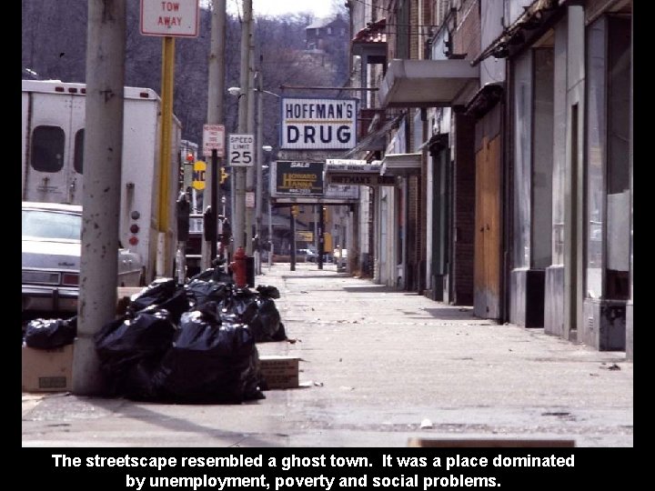 The streetscape resembled a ghost town. It was a place dominated by unemployment, poverty