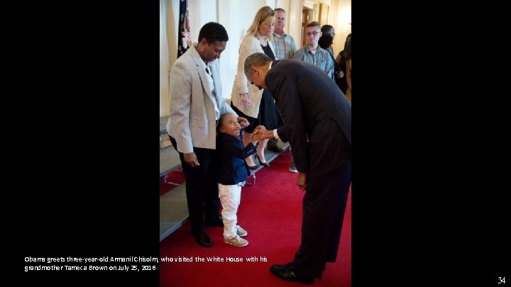 Obama greets three-year-old Armanil Chisolm, who visited the White House with his grandmother Tameca