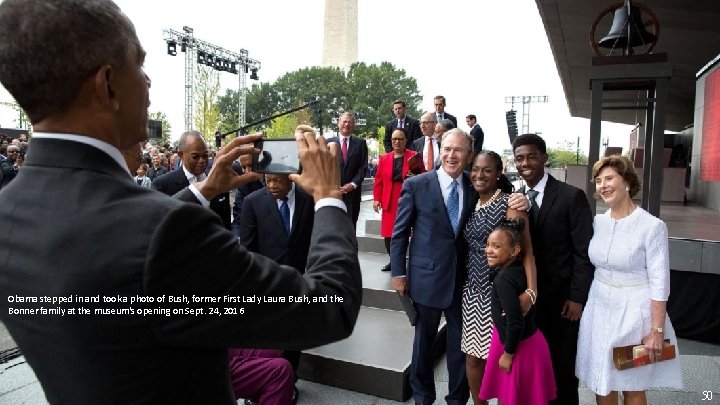 Obama stepped in and took a photo of Bush, former First Lady Laura Bush,