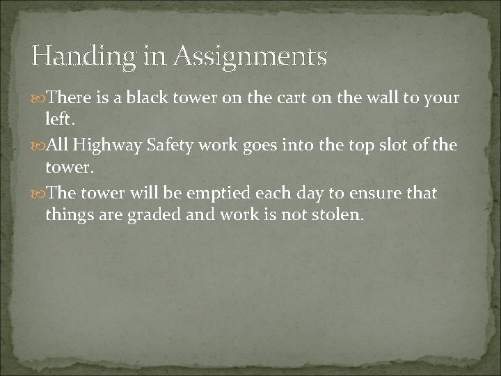 Handing in Assignments There is a black tower on the cart on the wall