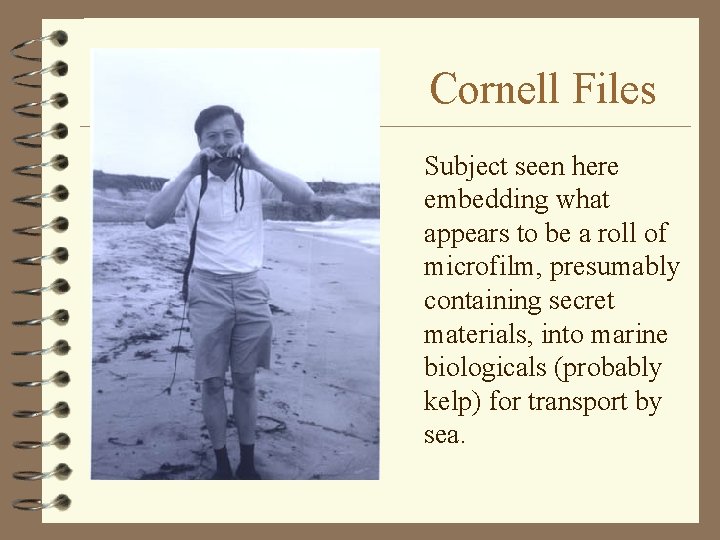 Cornell Files Subject seen here embedding what appears to be a roll of microfilm,