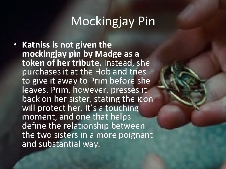 Mockingjay Pin • Katniss is not given the mockingjay pin by Madge as a