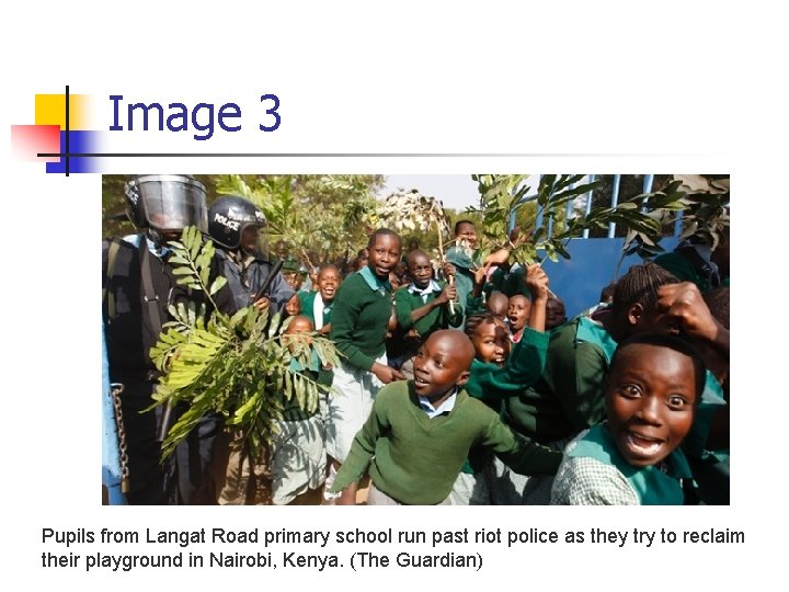Image 3 Pupils from Langat Road primary school run past riot police as they