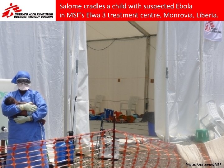 Salome cradles a child with suspected Ebola in MSF's Elwa 3 treatment centre, Monrovia,