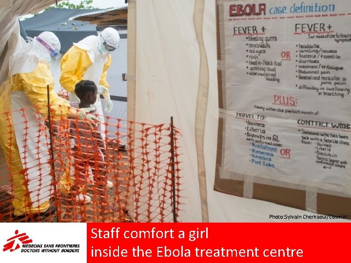 Photo: Sylvain Cherkaoui/Cosmos Staff comfort a girl inside the Ebola treatment centre 