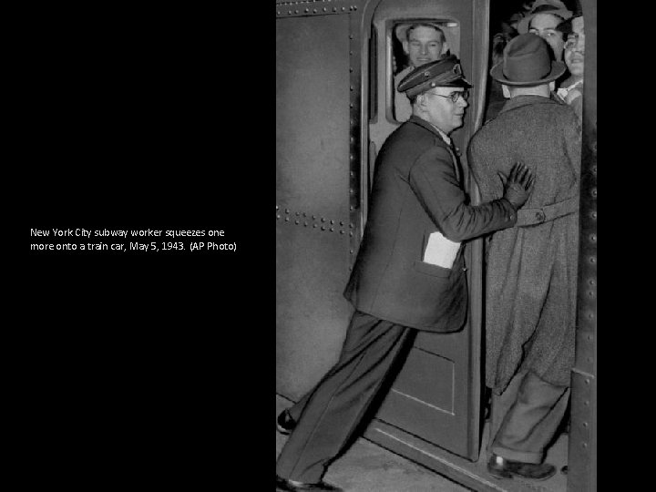 New York City subway worker squeezes one more onto a train car, May 5,