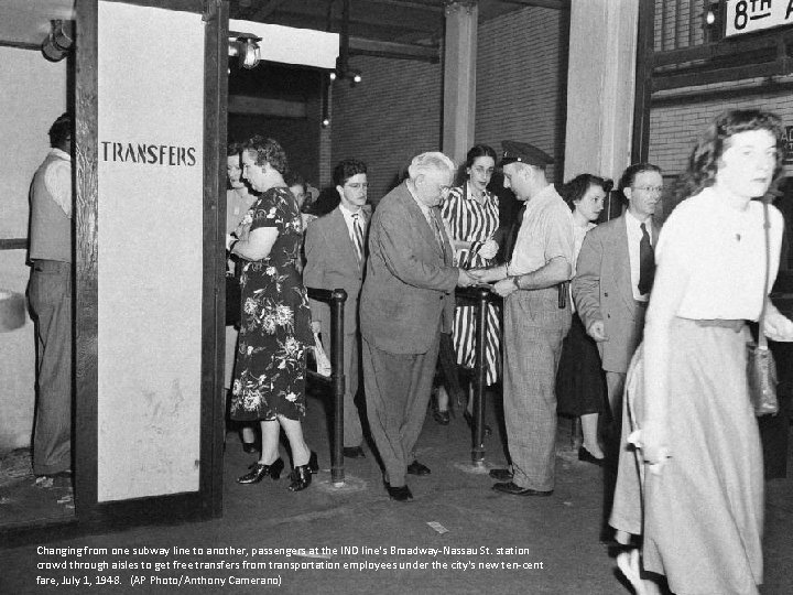 Changing from one subway line to another, passengers at the IND line's Broadway-Nassau St.