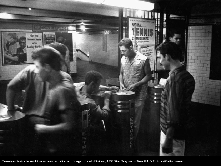 Teenagers trying to work the subway turnstiles with slugs instead of tokens, 1958. Stan