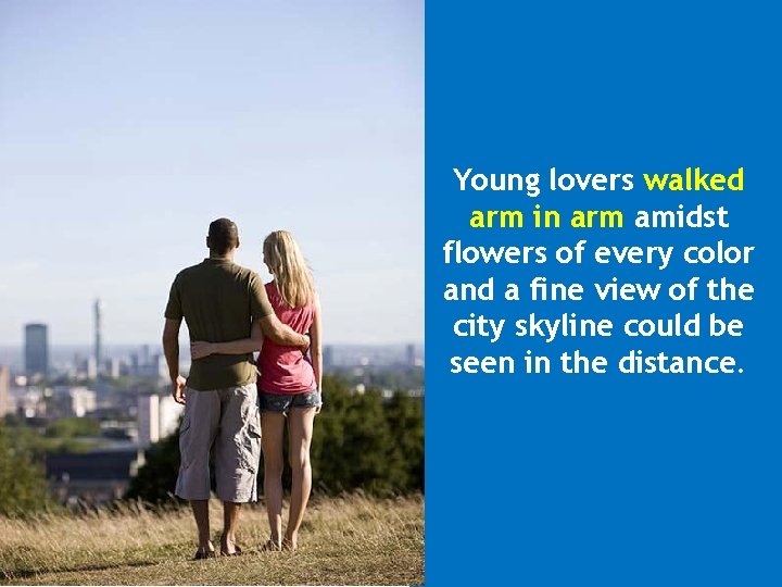 Young lovers walked arm in arm amidst flowers of every color and a fine