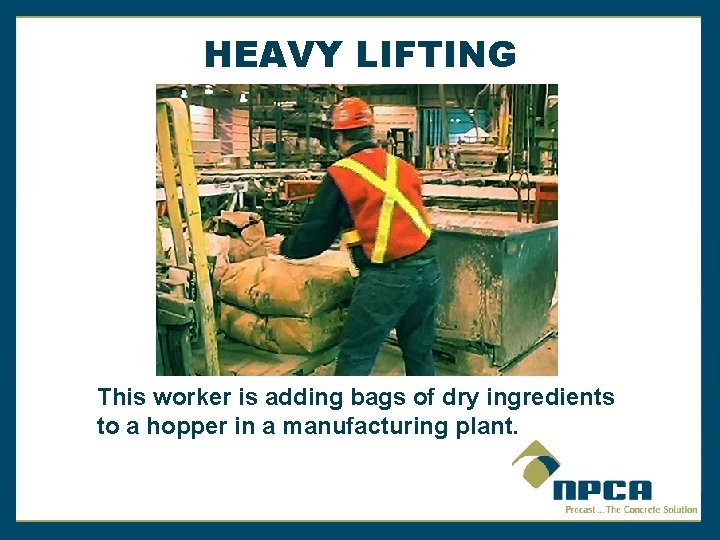 HEAVY LIFTING This worker is adding bags of dry ingredients to a hopper in