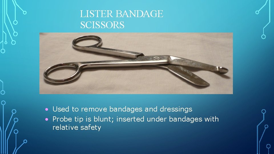 LISTER BANDAGE SCISSORS • Used to remove bandages and dressings • Probe tip is