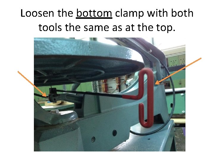 Loosen the bottom clamp with both tools the same as at the top. 