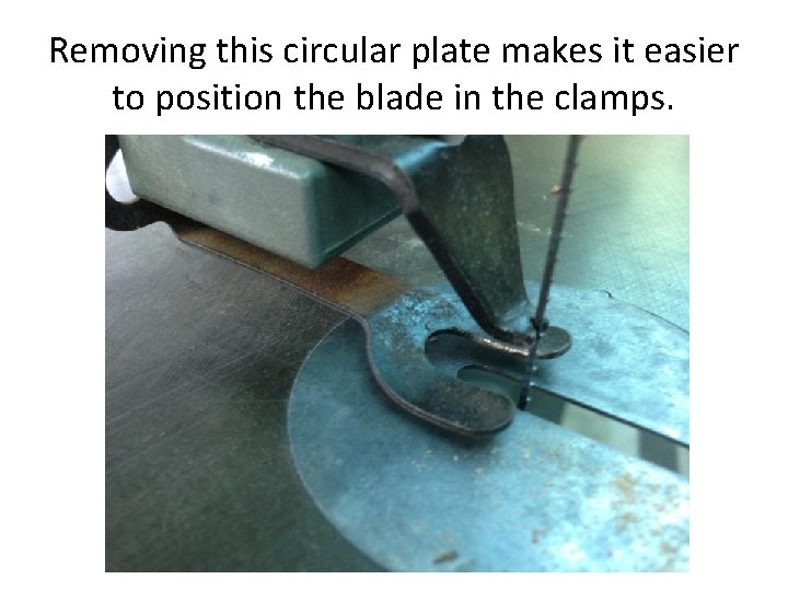 Removing this circular plate makes it easier to position the blade in the clamps.