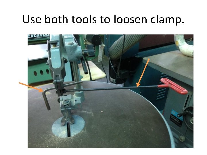 Use both tools to loosen clamp. 