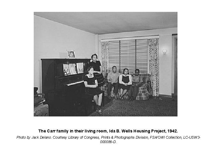 The Carr family in their living room, Ida B. Wells Housing Project, 1942. Photo
