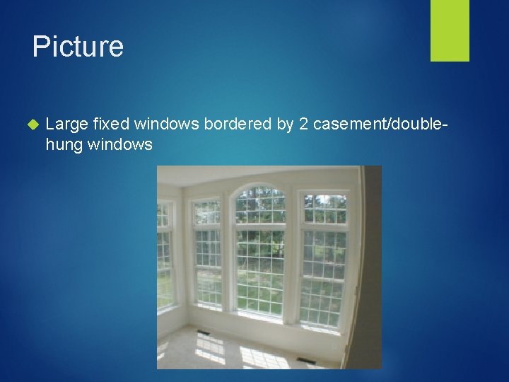 Picture Large fixed windows bordered by 2 casement/doublehung windows 