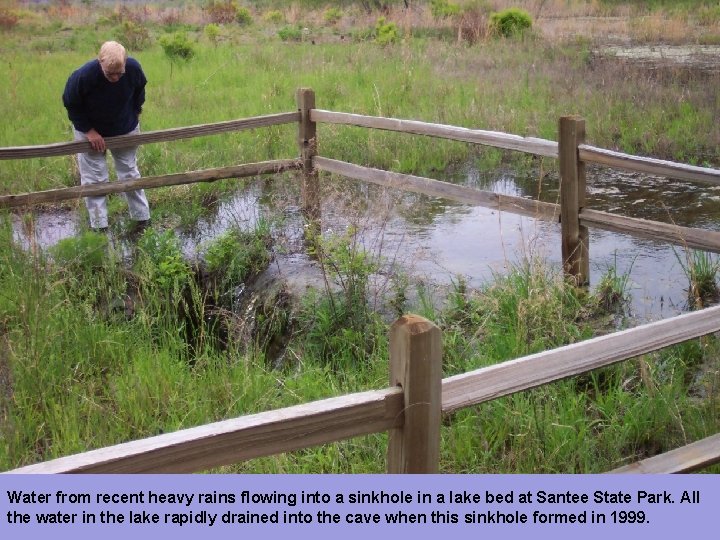 Water from recent heavy rains flowing into a sinkhole in a lake bed at
