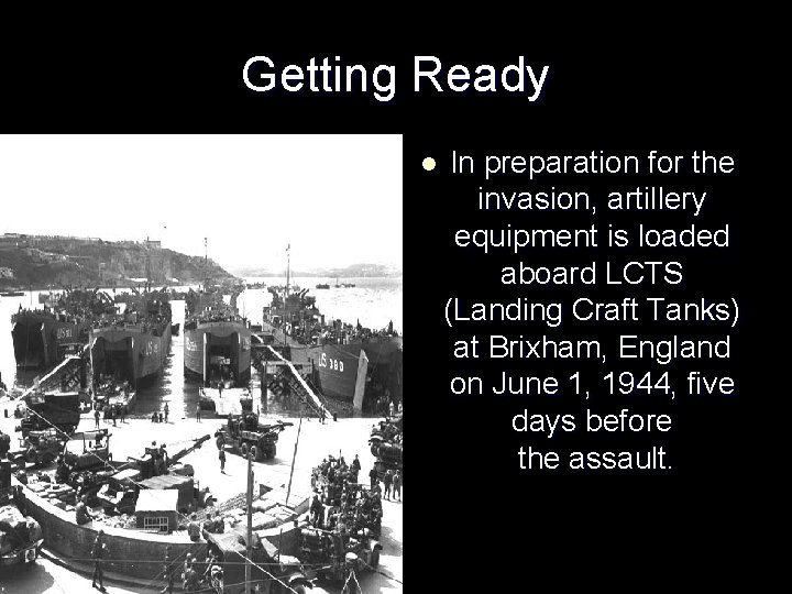 Getting Ready l In preparation for the invasion, artillery equipment is loaded aboard LCTS