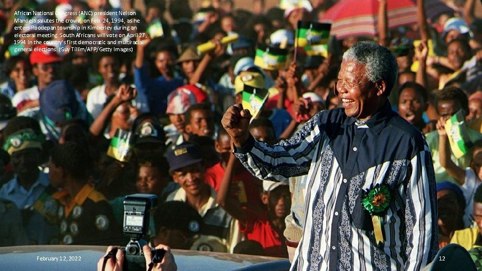 African National Congress (ANC) president Nelson Mandela salutes the crowd, on Feb. 24, 1994,