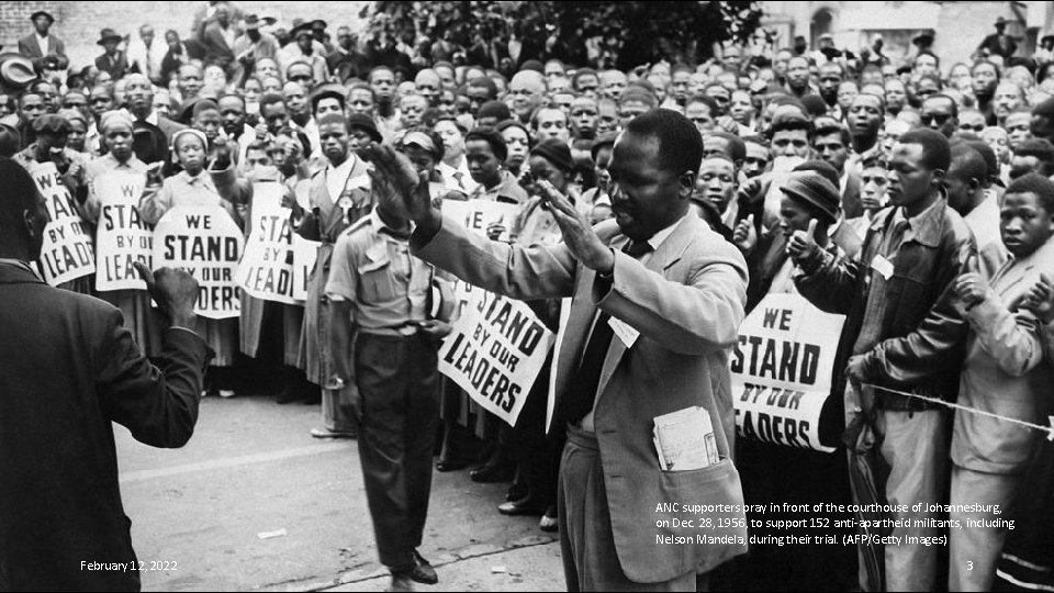 ANC supporters pray in front of the courthouse of Johannesburg, on Dec. 28, 1956,