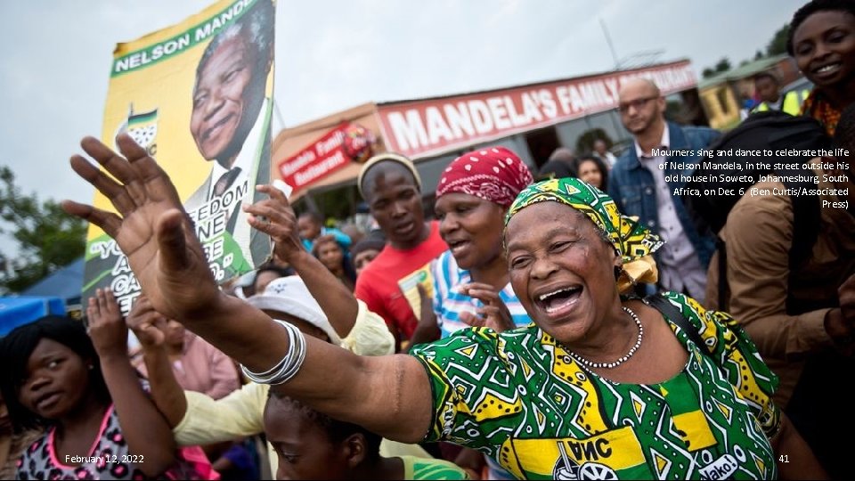 Mourners sing and dance to celebrate the life of Nelson Mandela, in the street