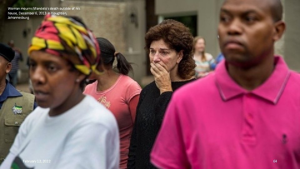 Woman mourns Mandela's death outside of his house, December 6, 2013 in Houghton, Johannesburg.