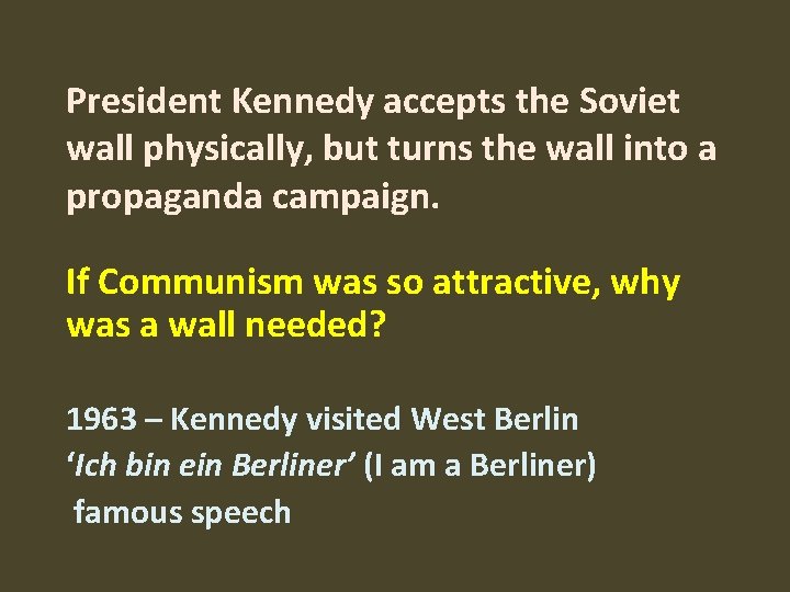 President Kennedy accepts the Soviet wall physically, but turns the wall into a propaganda