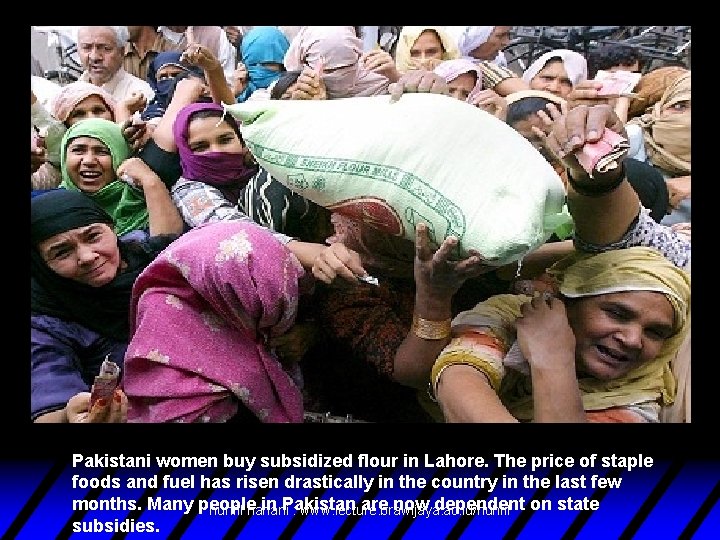 Pakistani women buy subsidized flour in Lahore. The price of staple foods and fuel