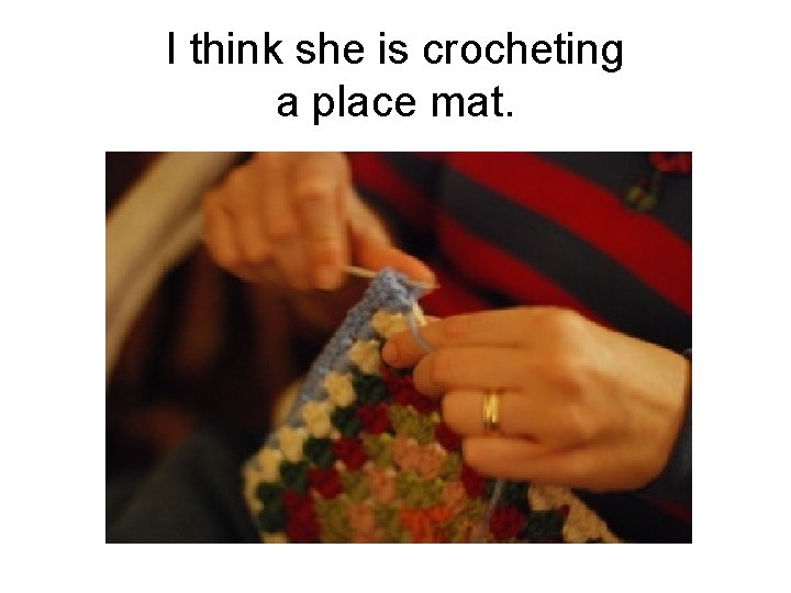 I think she is crocheting a place mat. 