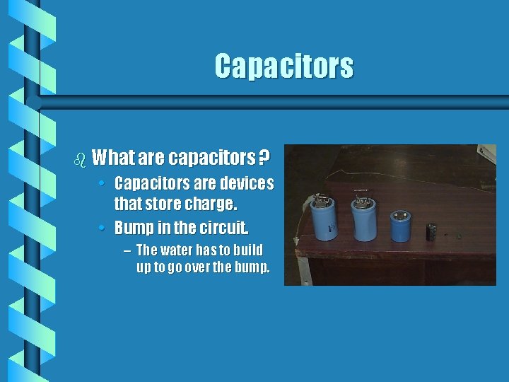 Capacitors b What are capacitors ? • Capacitors are devices that store charge. •