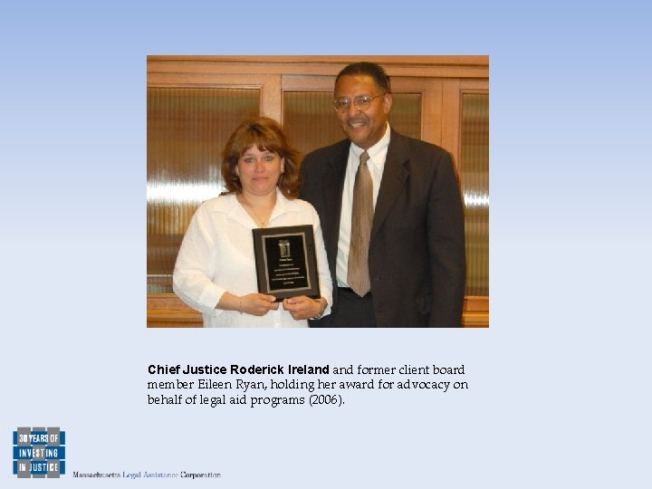 Chief Justice Roderick Ireland former client board member Eileen Ryan, holding her award for