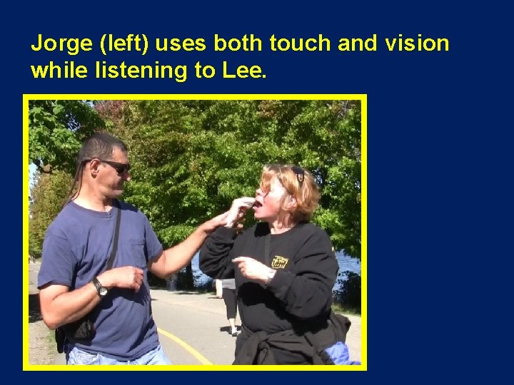 Jorge (left) uses both touch and vision while listening to Lee. 