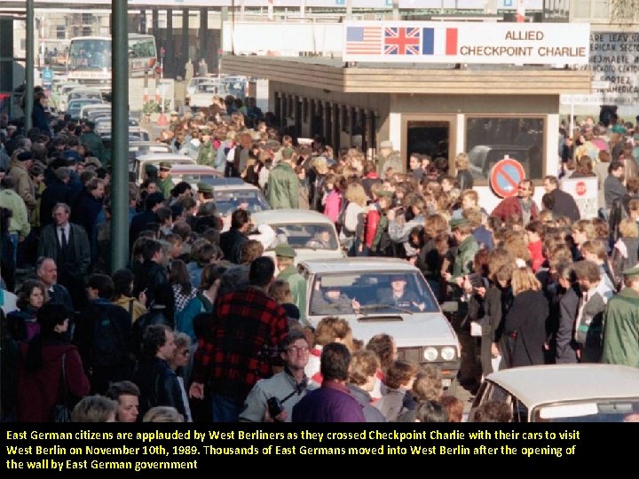 East German citizens are applauded by West Berliners as they crossed Checkpoint Charlie with