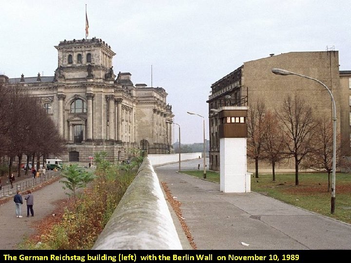 The German Reichstag building (left) with the Berlin Wall on November 10, 1989 