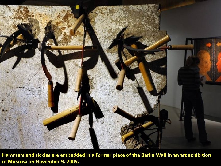 Hammers and sickles are embedded in a former piece of the Berlin Wall in