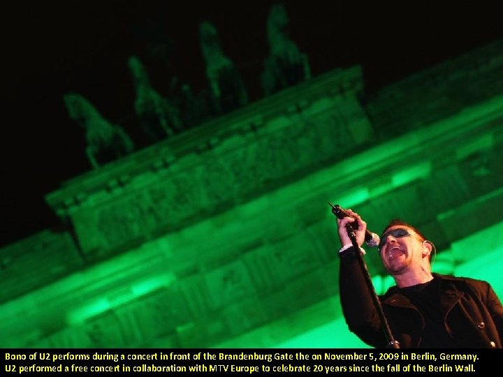 Bono of U 2 performs during a concert in front of the Brandenburg Gate