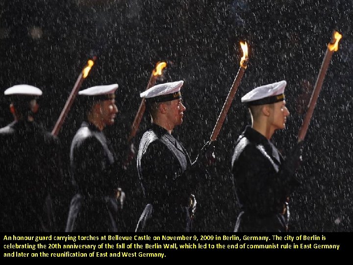 An honour guard carrying torches at Bellevue Castle on November 9, 2009 in Berlin,
