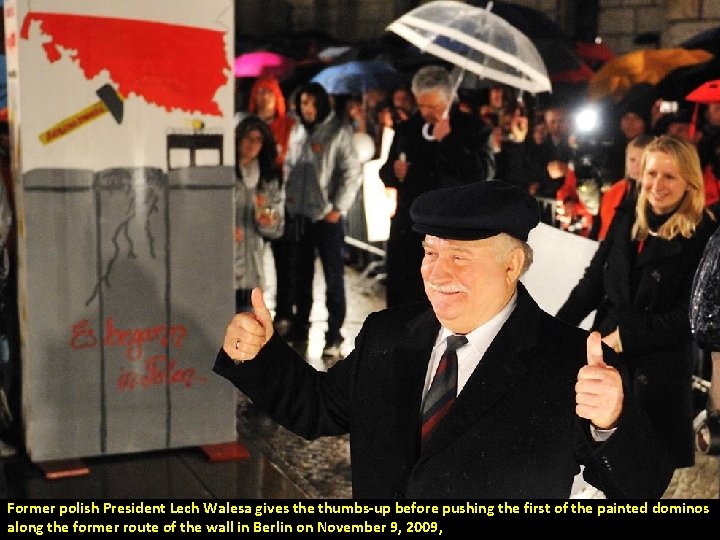 Former polish President Lech Walesa gives the thumbs-up before pushing the first of the