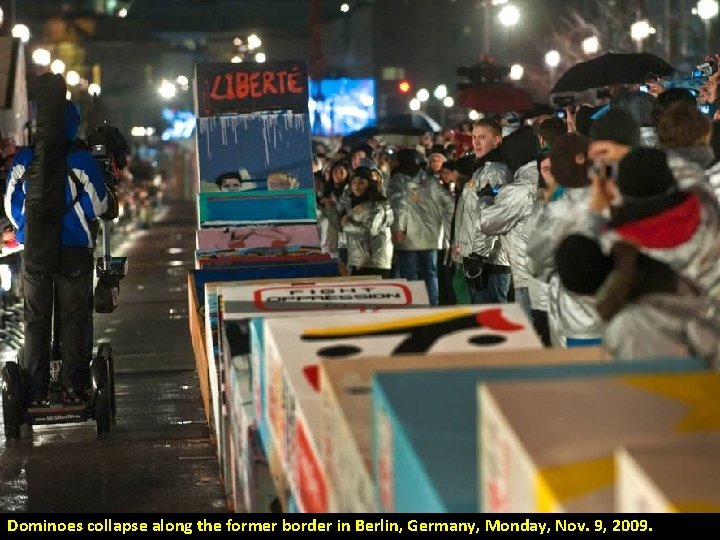 Dominoes collapse along the former border in Berlin, Germany, Monday, Nov. 9, 2009. 