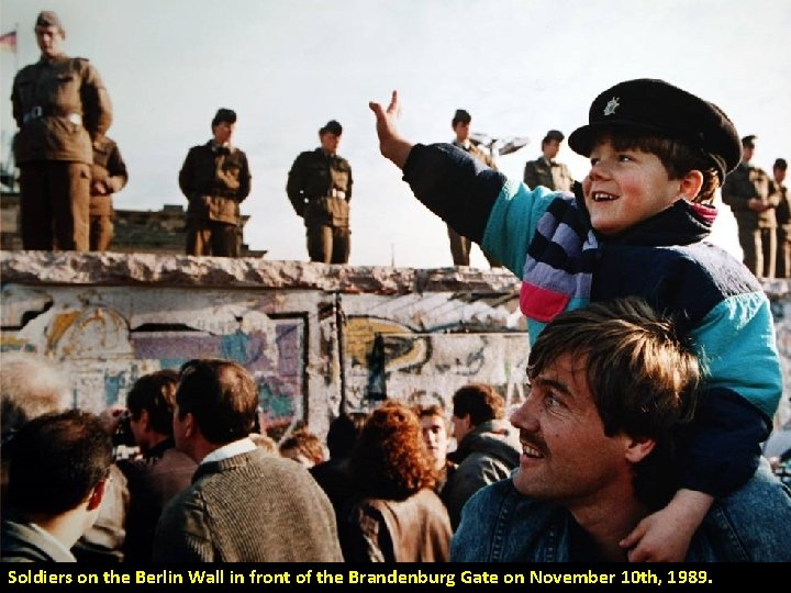 Soldiers on the Berlin Wall in front of the Brandenburg Gate on November 10